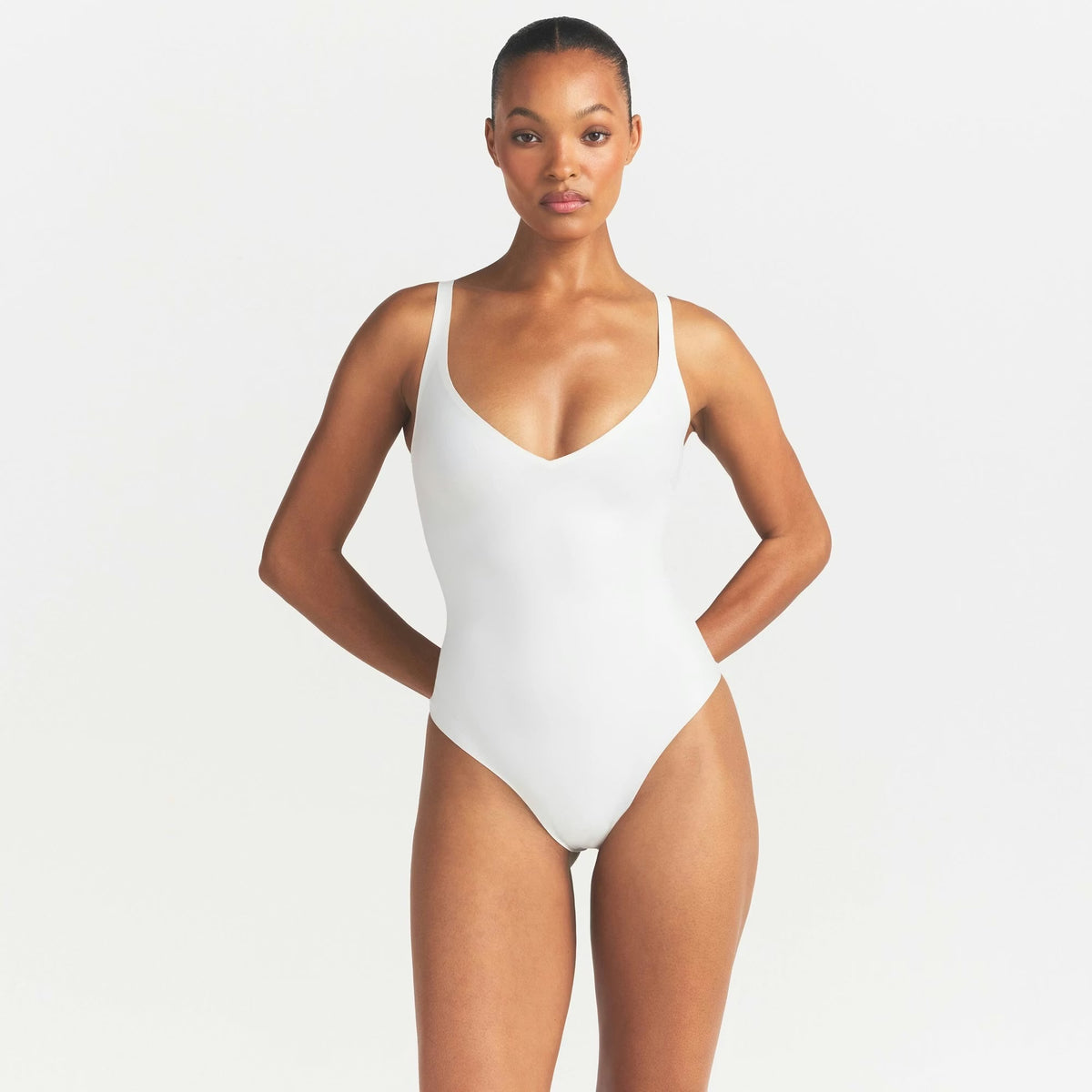 SKIMS BODY UNLINED PLUNGE THONG BODYSUIT